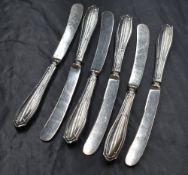 A cased set of six silver handled knives, having decorative line work, marks for Sheffield 1920,