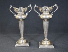 A pair of early George V silver vases, having lobed pierced rims, scroll 'S' curve handles and