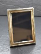 An Elizabeth II silver mounted wooden photograph frame, of rectangular form with twisted rope