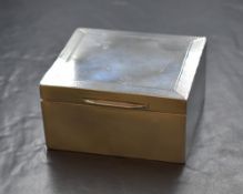 A George V silver cigarette box, of hinged square form having engine turned decoration and meander