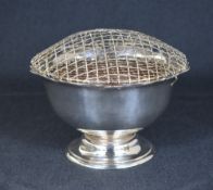 A George V silver rose bowl, of circular form having a Chippendale style rim with a filled centre,