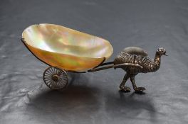 An Edwardian silver novelty pin cushion, modelled as an emu with mother-of-pearl shell cart,