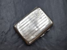 A George V silver cigarette case of hinged rectangular form slightly curved for the gentleman's