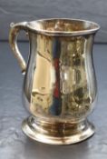 A George III silver tankard, of baluster form having a slightly flared rim and scroll handle with '