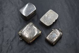 An Edwardian silver vesta case, of rectangular form with scroll engraving and 'MG' monogram, marks