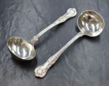 A pair of Victorian silver Queen's pattern sauce spoons, having a horse heraldic crest to the
