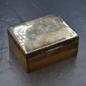 A George V silver cigarette box, of hinged rectangular form having wooden lined interior and plain