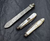 An Edwardian silver mounted letter opener/quill sharpener, having decorative scroll engraving and