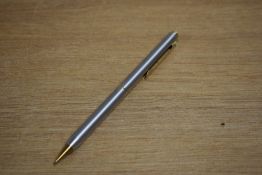 A Sheaffer Targa 1001x Brushed Steel with gold trim propelling pencil
