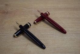 Two Parker Duofold Demi aerometric fill fountain pens one Burgundy one black both with Duofold broad