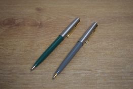 Two Parker 61 ballpoint pens in Sage Green and Grey with lustaloy caps and gold trim
