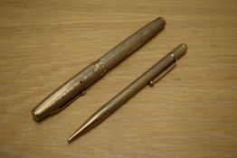 A Waterman lever fill fountain pen and propelling pencil set in 9CT Gold marked .375 with engine