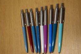 Nine Parker Jotter ballpoint pens in various colours (one engraved having a converter from LSD to