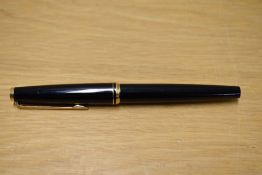 A Montblanc 320 Classic cartridge fill fountain pen in Black with gold trim having Montblanc nib