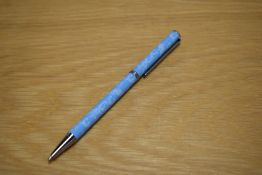 A boxed Clarance House ballpoint pen in pale blue with foliated decal