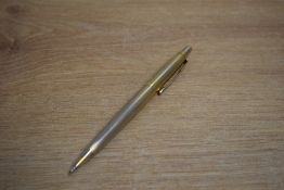 A Parker 45 ballpoint pen in gold reeded design