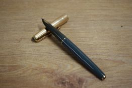 A Parker Custom Insignia converter fill fountain pen in grey with rolled gold cap