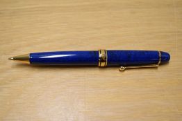 A L'Plume ballpoint pens in blue with gold trim.