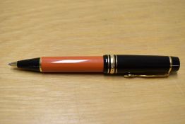 A Montblanc Writers Edition Ernest Hemingway ballpoint pen (NE0889/06) with orange barrel black