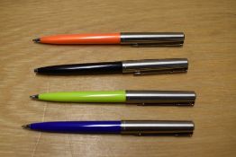 Four Parker 15 ballpoint pens in black, blue, orange and lime green