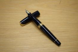 A Waterman Charleston converter fill fountain pen in black with gold trim having Waterman Paris