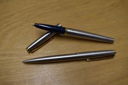 A Parker 45 Deluxe Flighter cartridge fill pen and ballpoint pen with gold trim
