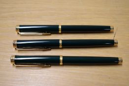 Two Waterman Gentleman cartridge converter fill fountain pens and a rollerball pen in Green Laque