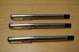 A Parker Rialto converter fill fountain pen and two rollerball pens in Cornith Silver plate