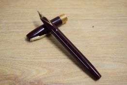 A Sheaffer Triumph Imperial cartridge fill fountain pen in Burgundy having Sheaffer 14K nib