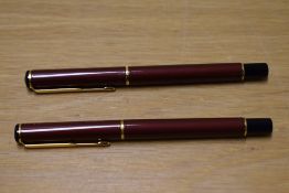 Two Parker Rialto converter fill fountain pens in Metallic Maroon