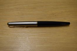 A Parker 45 cartridge fill fountain pen in black having a lutraloy cap with gold trim