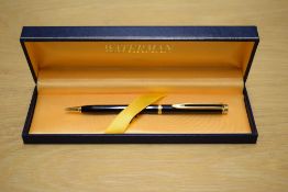 A boxed Waterman Gentleman ballpoint pen in black with gold trim
