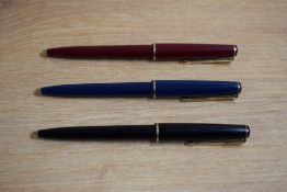 Three Parker 17 Jotter ballpoint pens in black,red and blue with gold trim