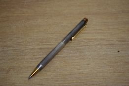 A Sheaffer Targa 1004x Sterling Silver straight line pattern with gold plated trim ballpoint pen