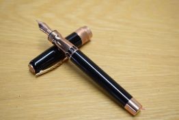 A boxed Pineider La Grand Bellezza piston fill fountain pen in black with Rose gold trim having