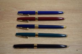 Five Sheaffer Imperial ballpoint pens in Green,, Red, Black, Blue, and Dark Blue