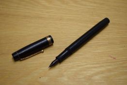 An Onoto Self Filler Stylo pen in black