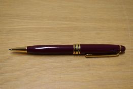 A L'Plume ballpoint pens in burgundy with gold trim.