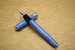 A boxed Pineider La Grand Bellezza converter fill fountain pen in Full Metal Jacket Sugar Paper