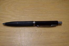 A Parker Reflex ballpoint pen in black with chrome trim