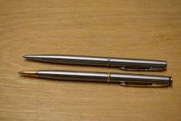 Two Parker Insignia ballpoint pens in Flighter one with gold trim