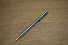 A Sheaffer Targa 1001x Brushed Steel with gold trim ballpoint pen