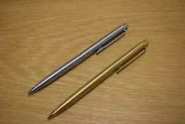 Two Papermate propelling pencils one in gold the other in brushed steel