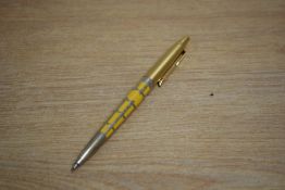 A Parker Jotter 50th Anniversary edition ballpoint pen in saffron yellow with silver filigree and