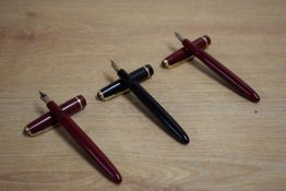Three Parker Slimfold aerometric fill fountain pens two in red one black with Slimfold cap band