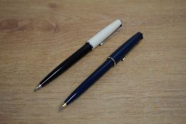 Two Parker 45 CT (aka The Arrow) ballpoint pens one black with white cap the other dark blue