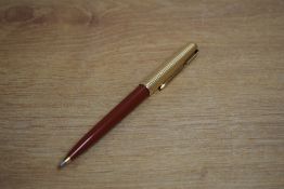 A Parker 61ballpoint pen in Burgundy with Consort rolled gold cap