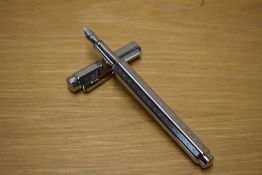 A Caran d'Ache Ecridor Chevron converter fill fountain pen with palladium plated barrel having