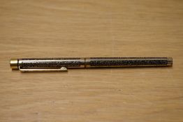 A Sheaffer TRZ Targa slim cartridge fill fountain pen in black and gold with etched patterned panels