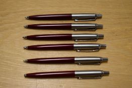 Six Parker Jotter ballpoint pens in burgundy